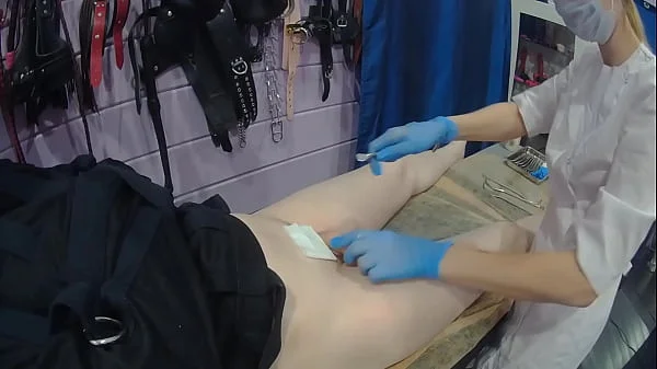 Medical fetish sounding in straitjacket