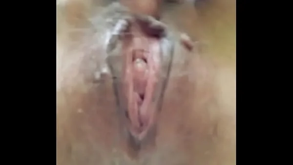 Naked horny MILF in a chamomile field masturbates, pisses and wards off a wasp / Angela-MILF