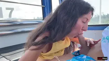 Beauty sucks cock on a Ferris wheel in an amusement park