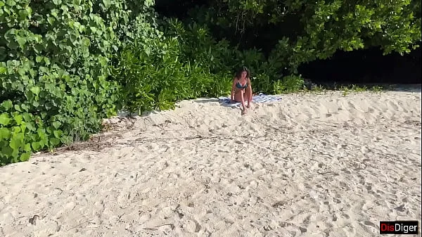 Pissed on girl on a public beach - She was shocked