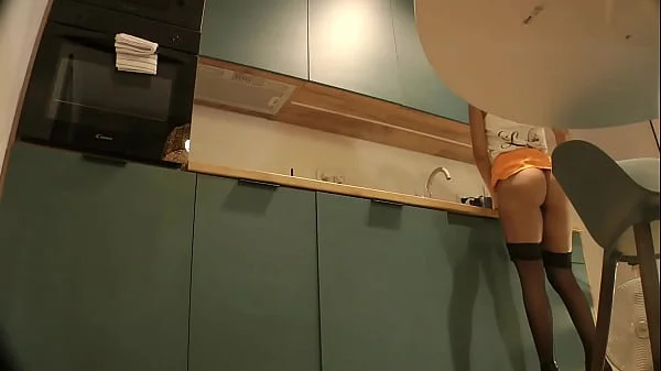 Panties Flash of a Cute Sexy Housewife on High Heels and Stockings in a Mini Short Skirt