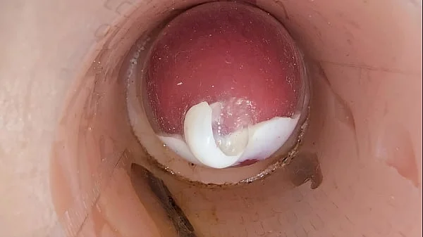 The camera in the deep pussy records a huge ejaculation of sperm into the condom