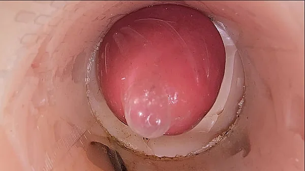 The camera in the deep pussy records a huge ejaculation of sperm into the condom