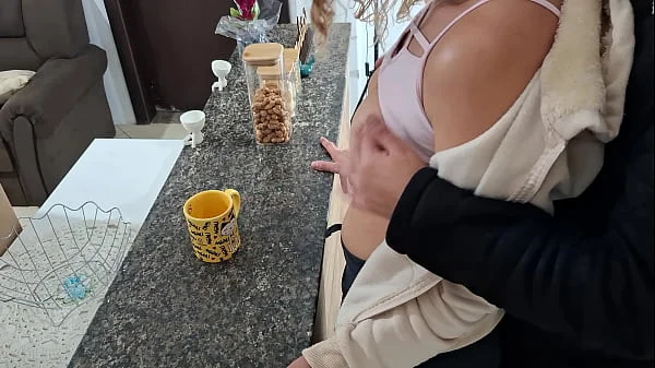 A stepdaughter is surprised while having breakfast.