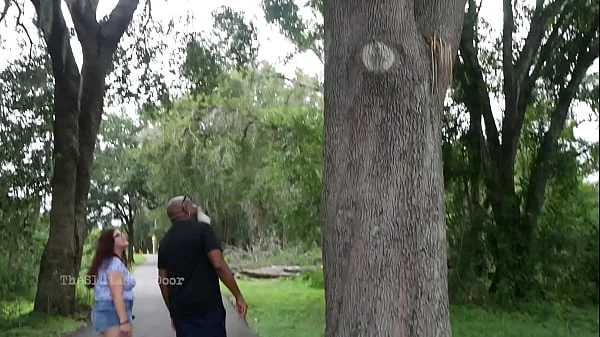 Nerdy Milf strokes and suck blk dick in the Park