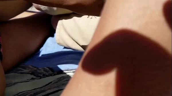 Girl Masturbates boyfriend on a public beach