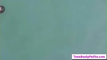 Sexy busty teen brunette Annika Eve swim in the pool naked and suck cock outside