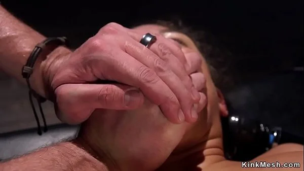 Tied up and hanged brunette toyed