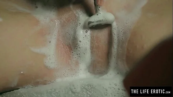 Horny milf shaves and squirts to orgasm while held in a basement