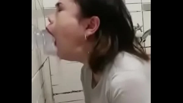 Asian deepthroating a dildo