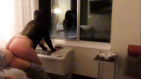 Having fun wearing a see through short dress in hotel public areas