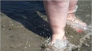 Fat Bare Legs With Red Pedicure Walk Along The Bank Of The River, Fetish