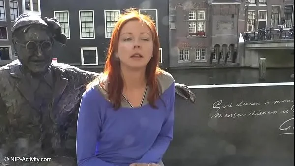 Pretty redhead walking naked in Amsterdam