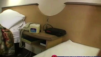 Horny slut grabs cock and jerks it off while topless