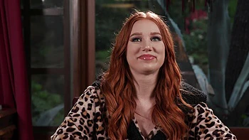 The red head Madison Morgan shows her assets in a captivating video