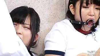 He puts a collar on the slave and fingers him, then thrusts it deep into his throat and fucks him.