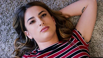 Markus Dupree and stunning Kristen Scott in lingerie, showcasing her petite frame and natural charm.