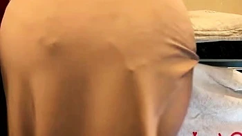 Brunette seductress working her big boobs and hot ass