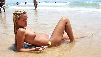 Good outdoor posing session on the beach with a busty Sophie Moone