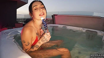 Two hot lesbians are having fun in the swimming pool