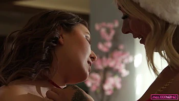 Chloe Temple and Leana Lovings engage in playtime with Yuletide novelties.
