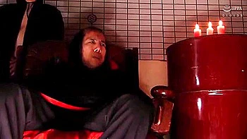 She is hit with a vibrator, fingered, and has a vibrator inserted and removed until she cums.