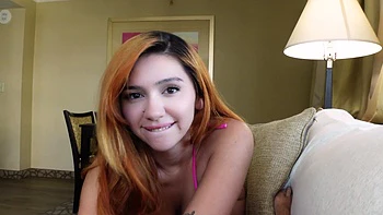 Redhead latina Cherry Gwendolyn shows off big natural tits in bikini