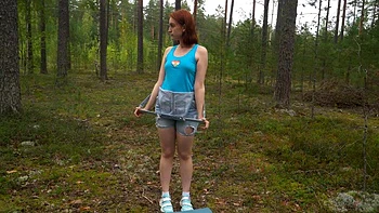 A red-haired hot teen Fergy Croak enjoys solo masturbation outdoors