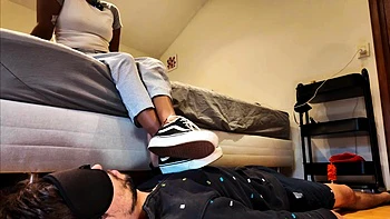 Light femdom and foot fetish play with brunette