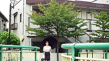 Big-Titted Asian Brunette Shows Off Huge Ass