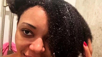 Ebony babe with big tits takes shower solo