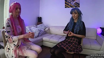 Teen Lily Angelic flaunts her perky tits and tiny thong in a miniskirt